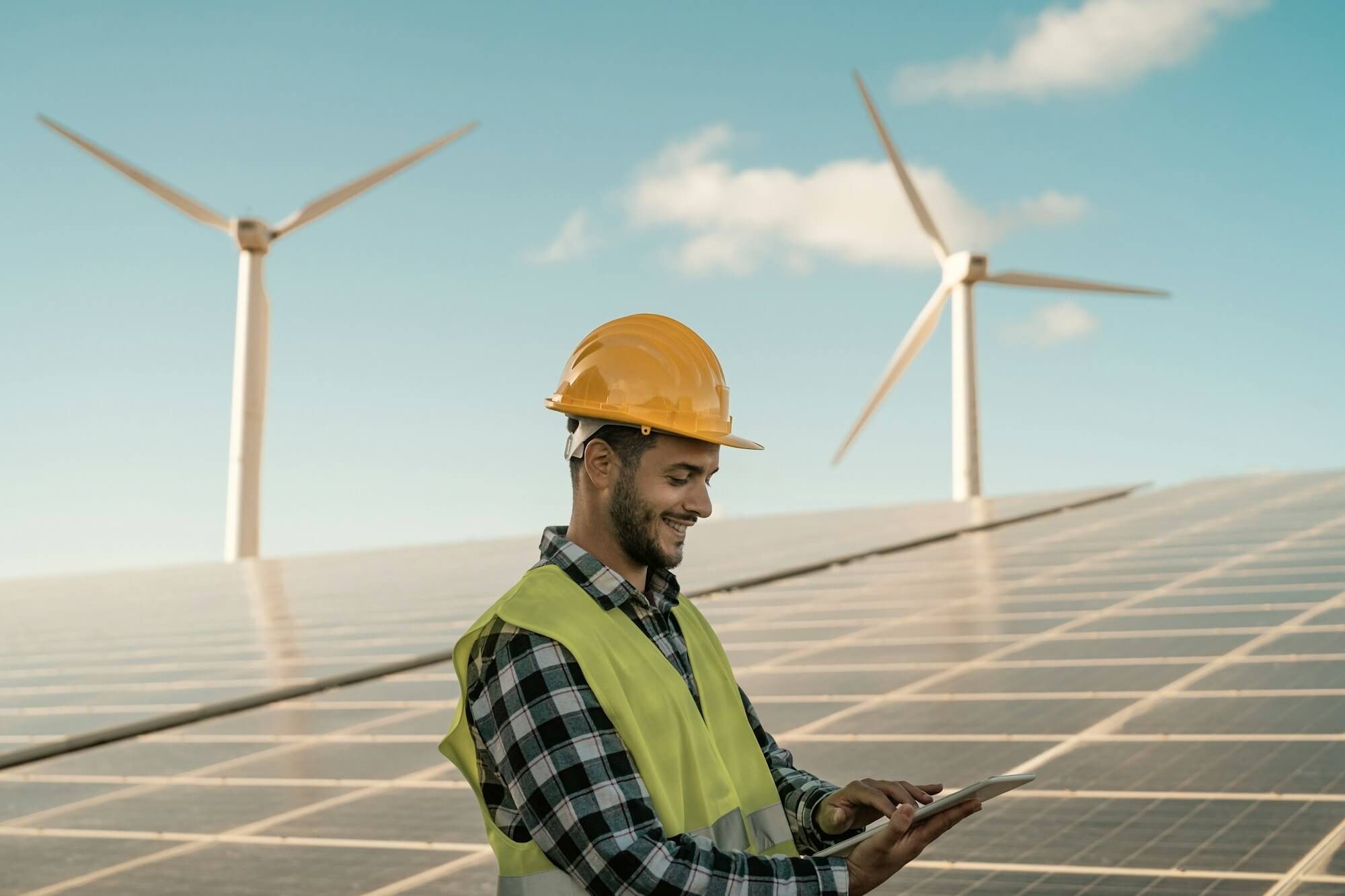 young-engineer-watching-on-digital-tablet-the-new-green-plan-for-alternative-energy.jpg